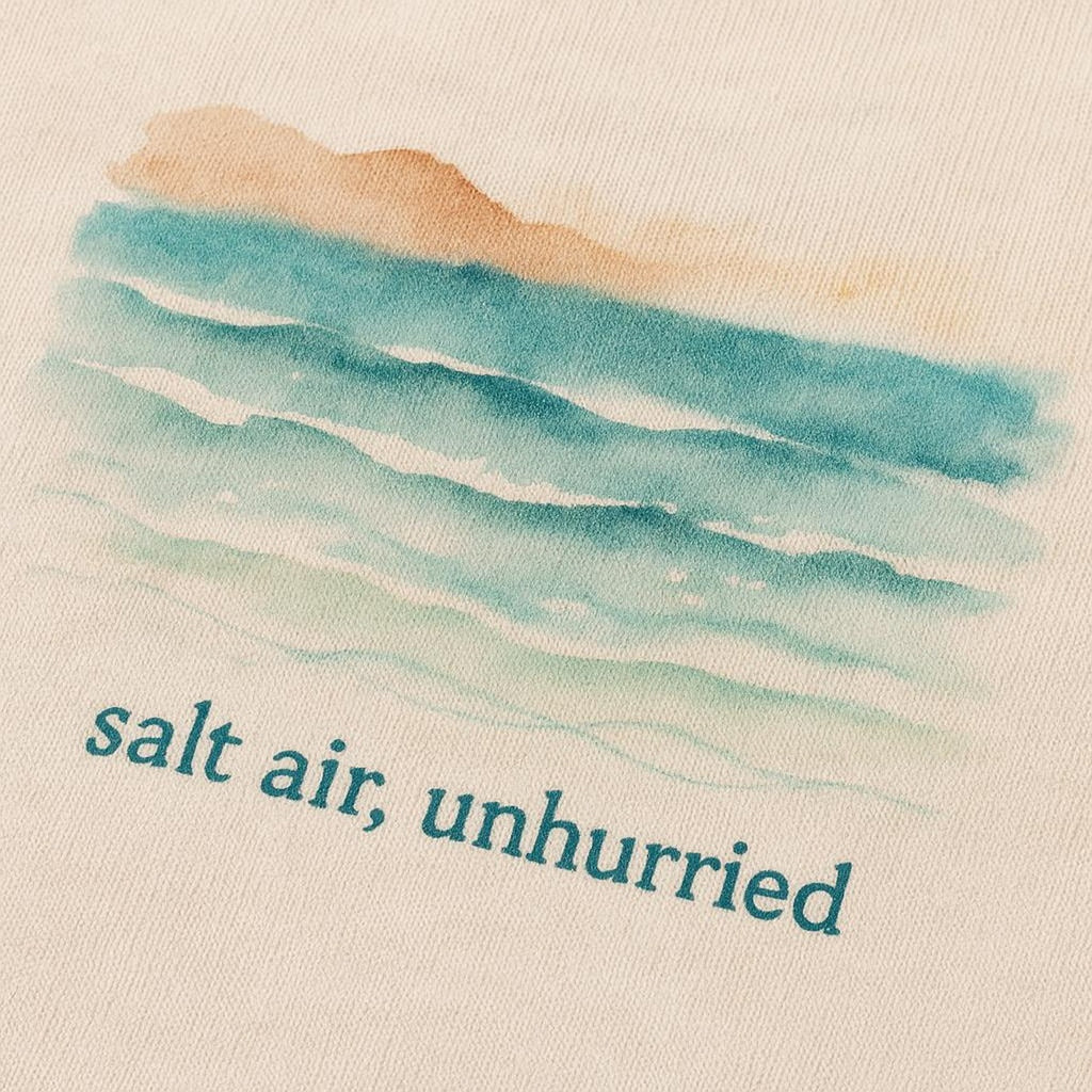 Close-up of the tonal slow down motif printed near the shirt hem