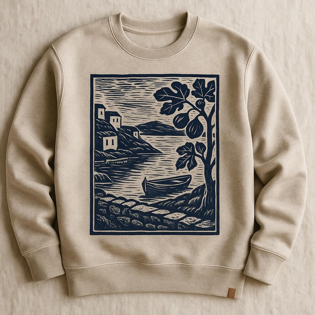 Folded stone beige sweatshirt styled beside figs and linen on a wooden kitchen table
