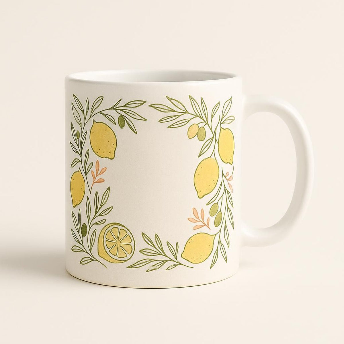 Hero shot of a white ceramic mug with a hand-drawn lemon and olive branch border on a plain background