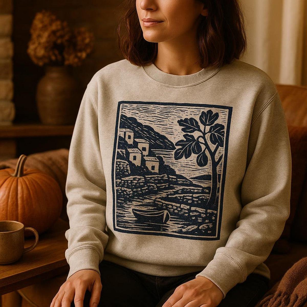 Person in relaxed beige sweatshirt cooking slowly in a sunlit Mediterranean kitchen