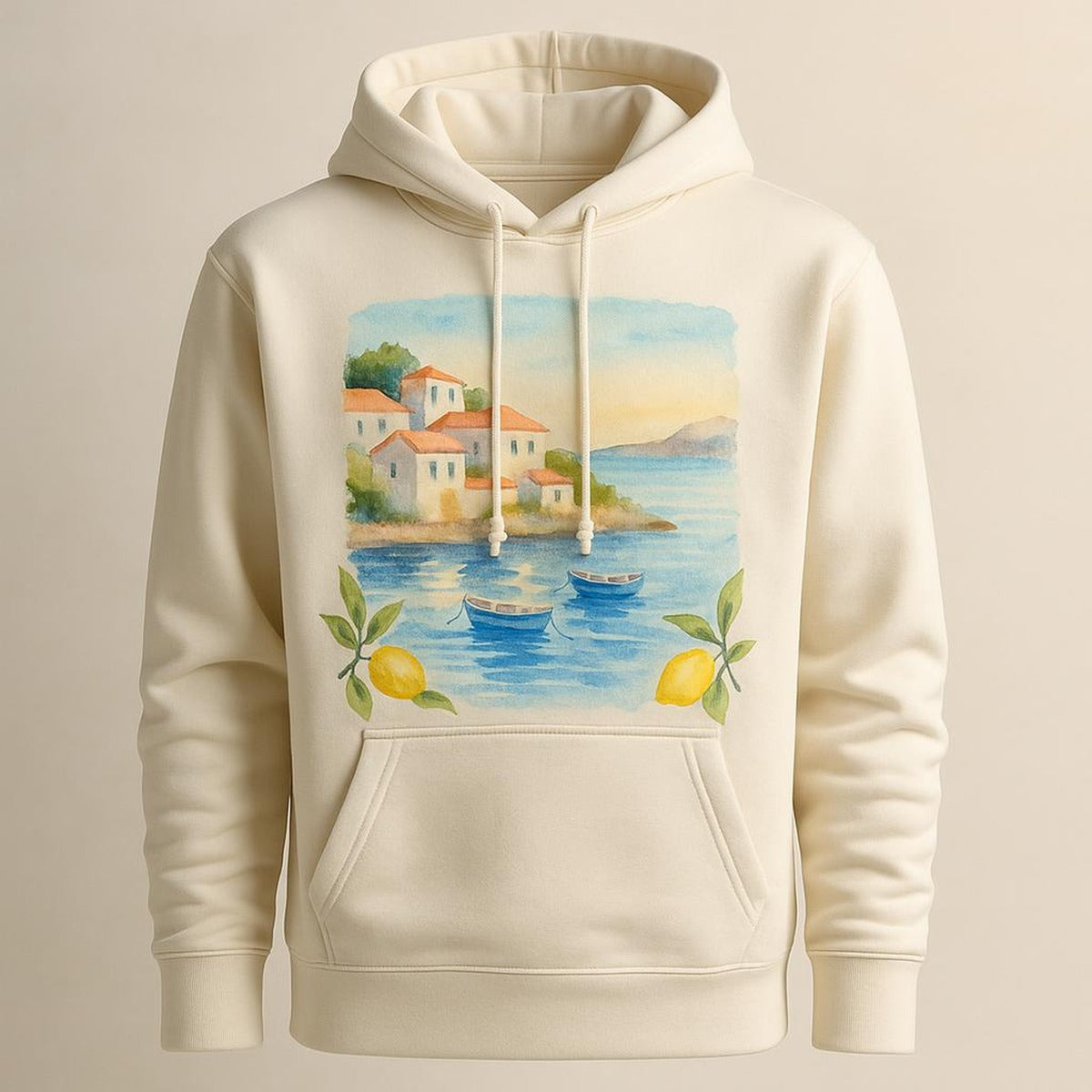 Folded coastal hoodie styled with raffia tote and linen on a sunlit table