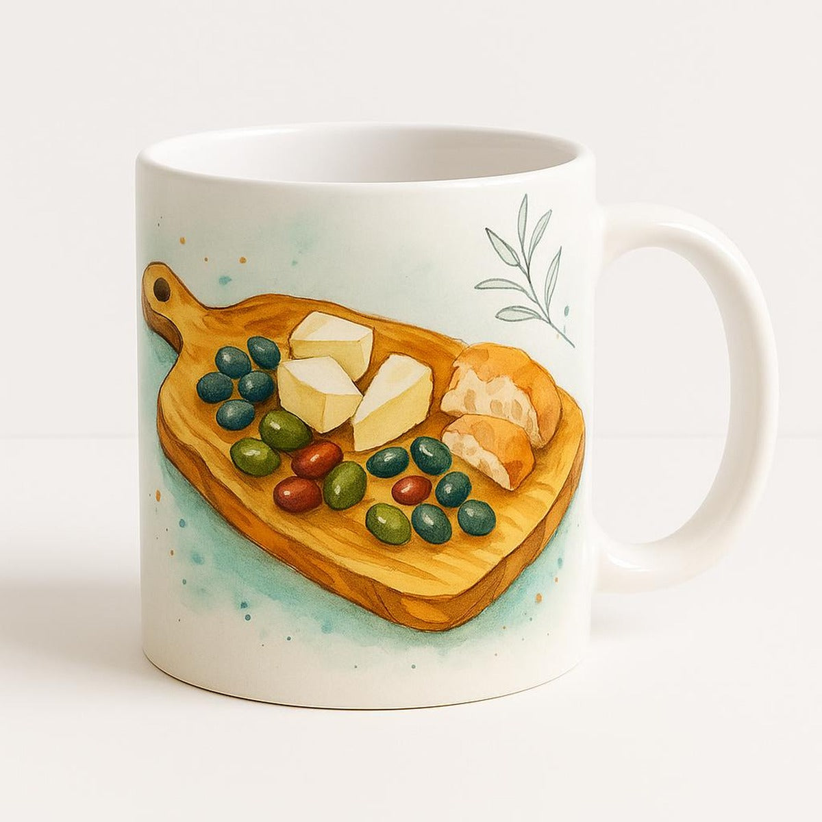 Sage green ceramic mug printed with an olive wood grazing board and hand-carved handle design, shown on a white background