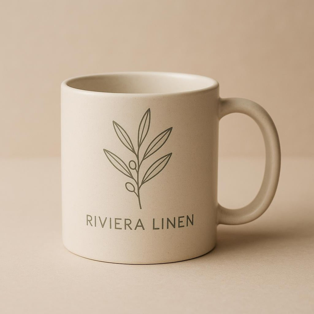 Overhead view of the mug filled with coffee next to olive branches
