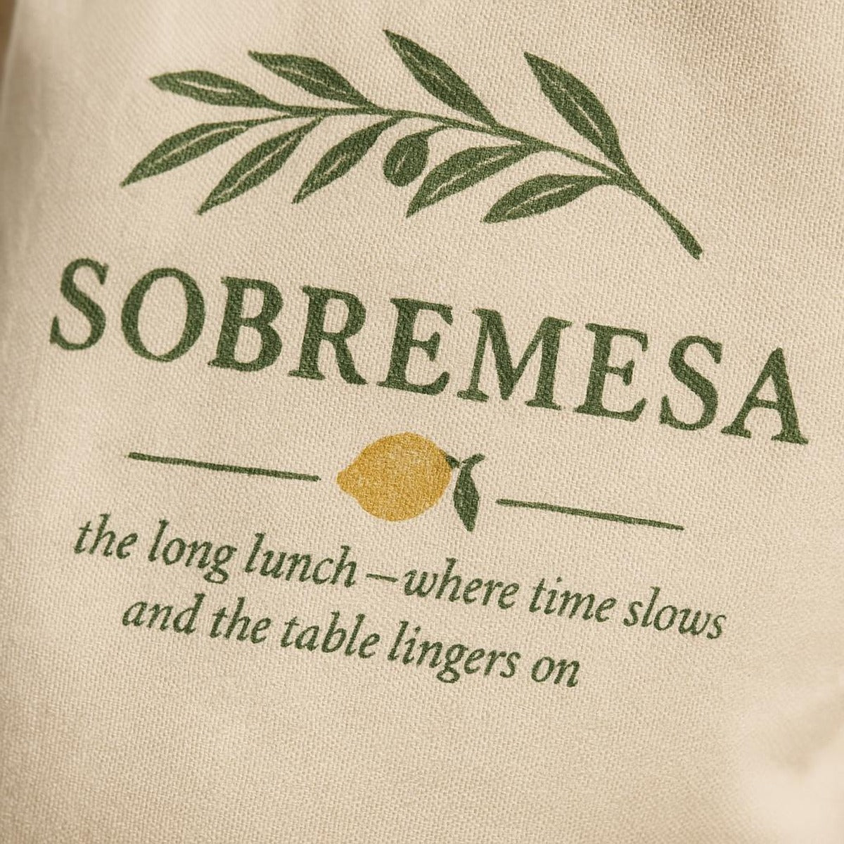 Close-up of the hand-drawn carafe illustration showing matte water-based ink detail on cotton canvas