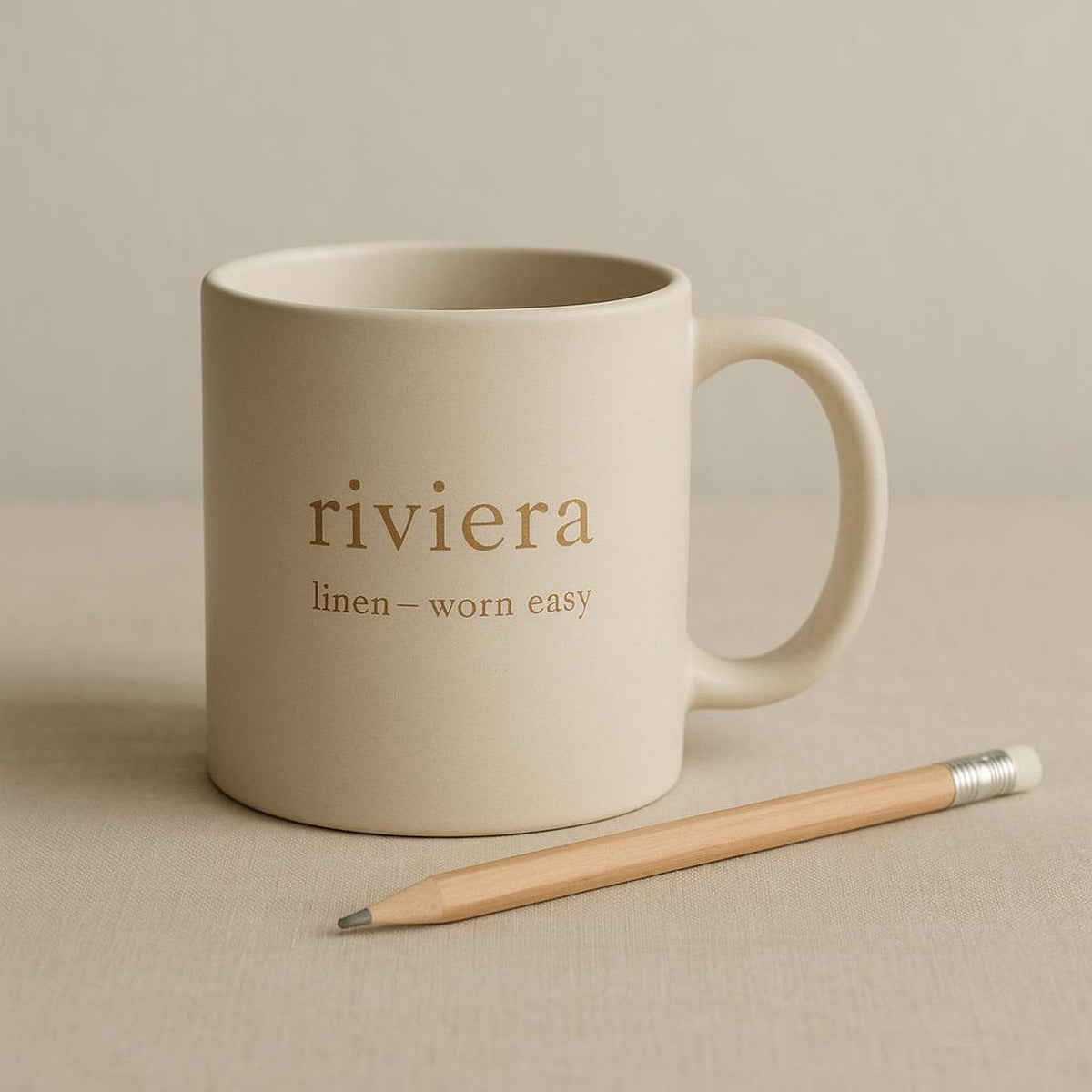 Hand holding the ceramic mug to show its comfortable easy-grip handle and scale