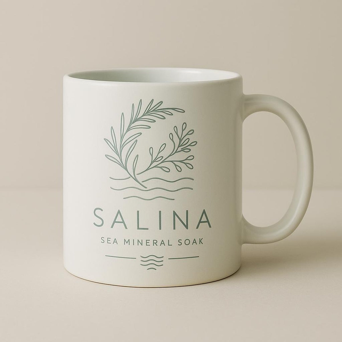 Scale image of the mug held in a hand to show its 11oz everyday size