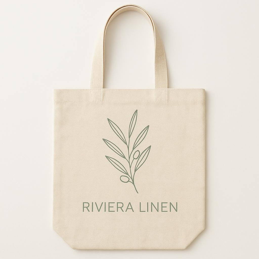 Natural cotton canvas tote bag printed with a muted linen camp-collar shirt design, shown flat against a plain backdrop