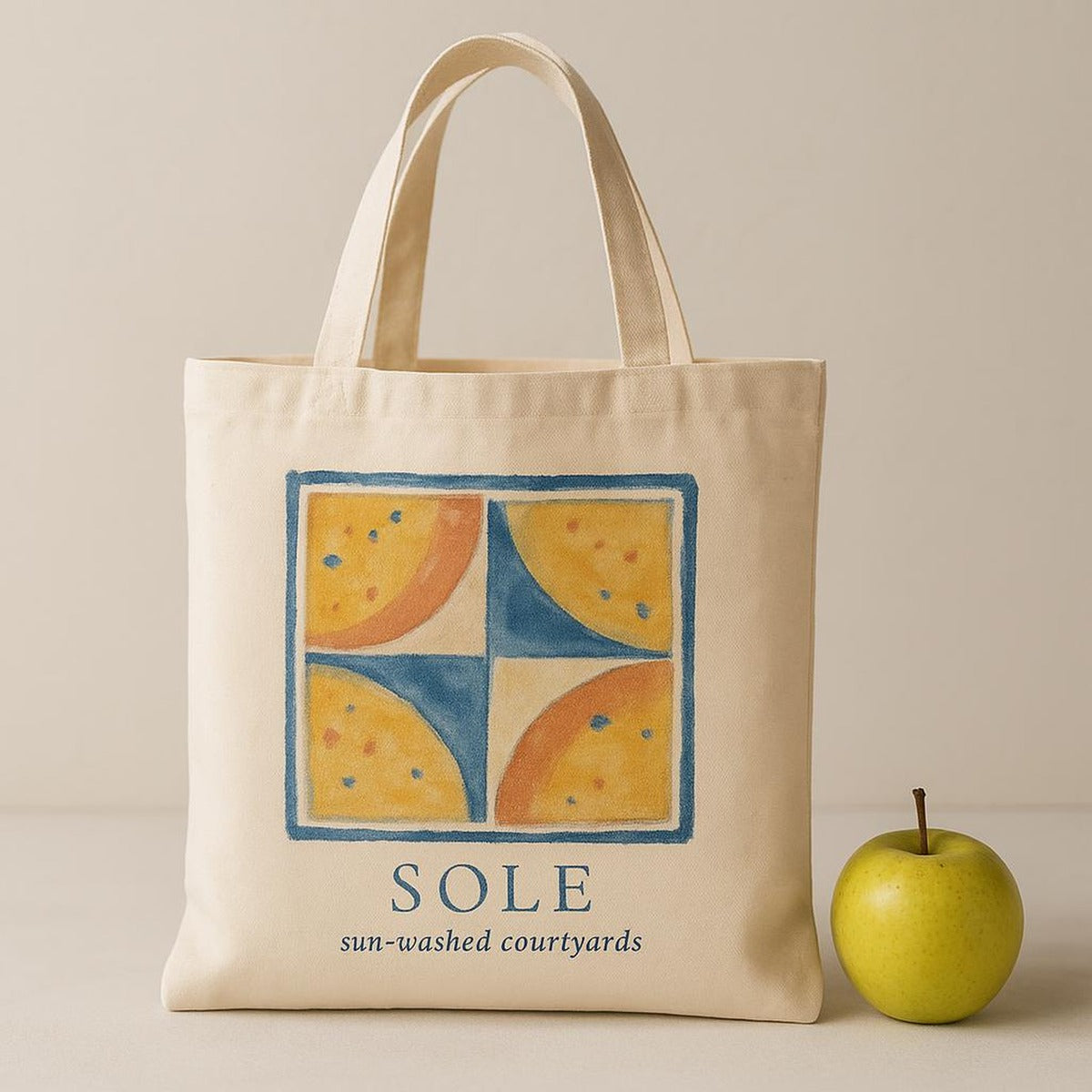 Scale image showing the tote held in hand, filled with fresh bread, flowers and a rolled towel