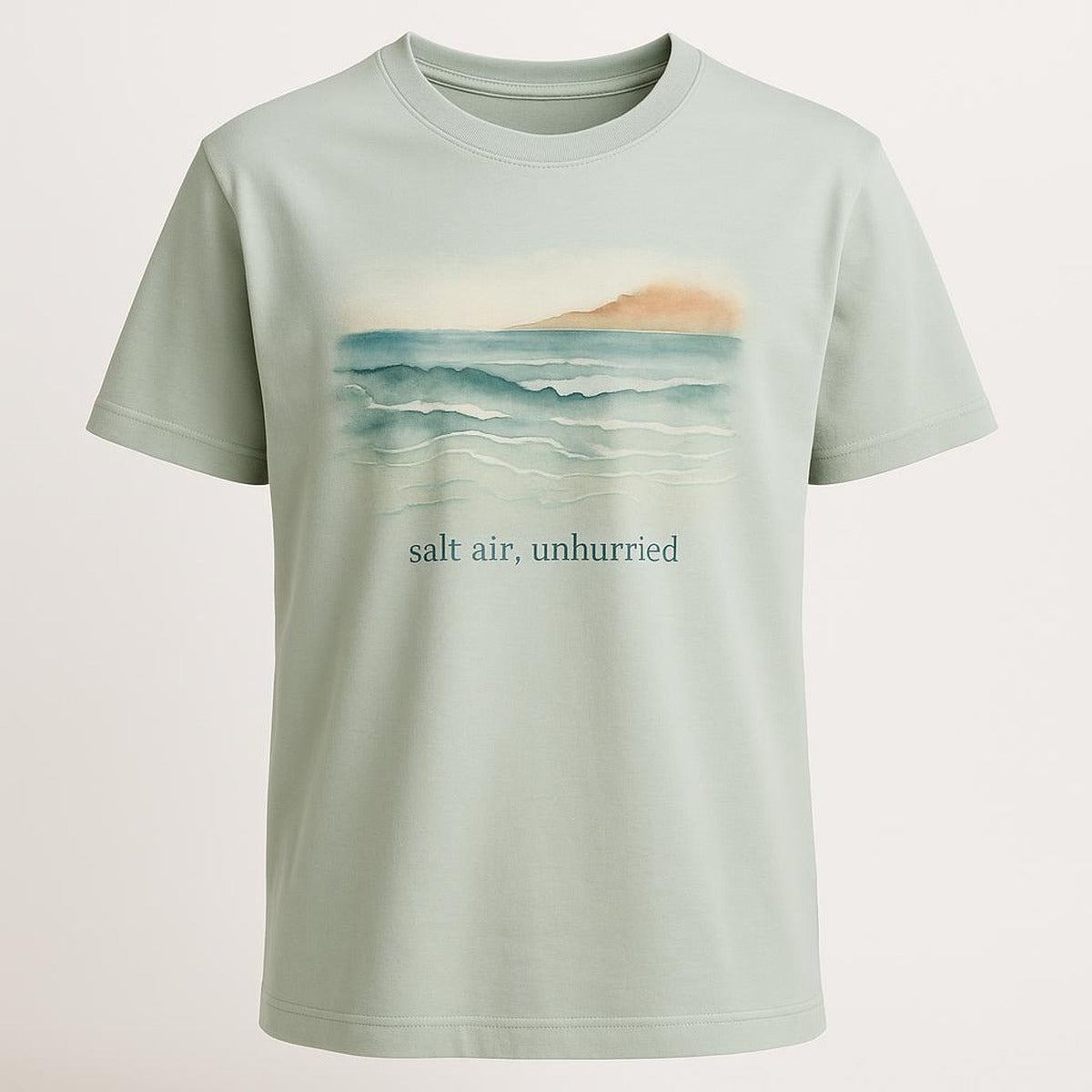 Sea-glass green premium cotton t-shirt laid flat showing relaxed crew-neck fit