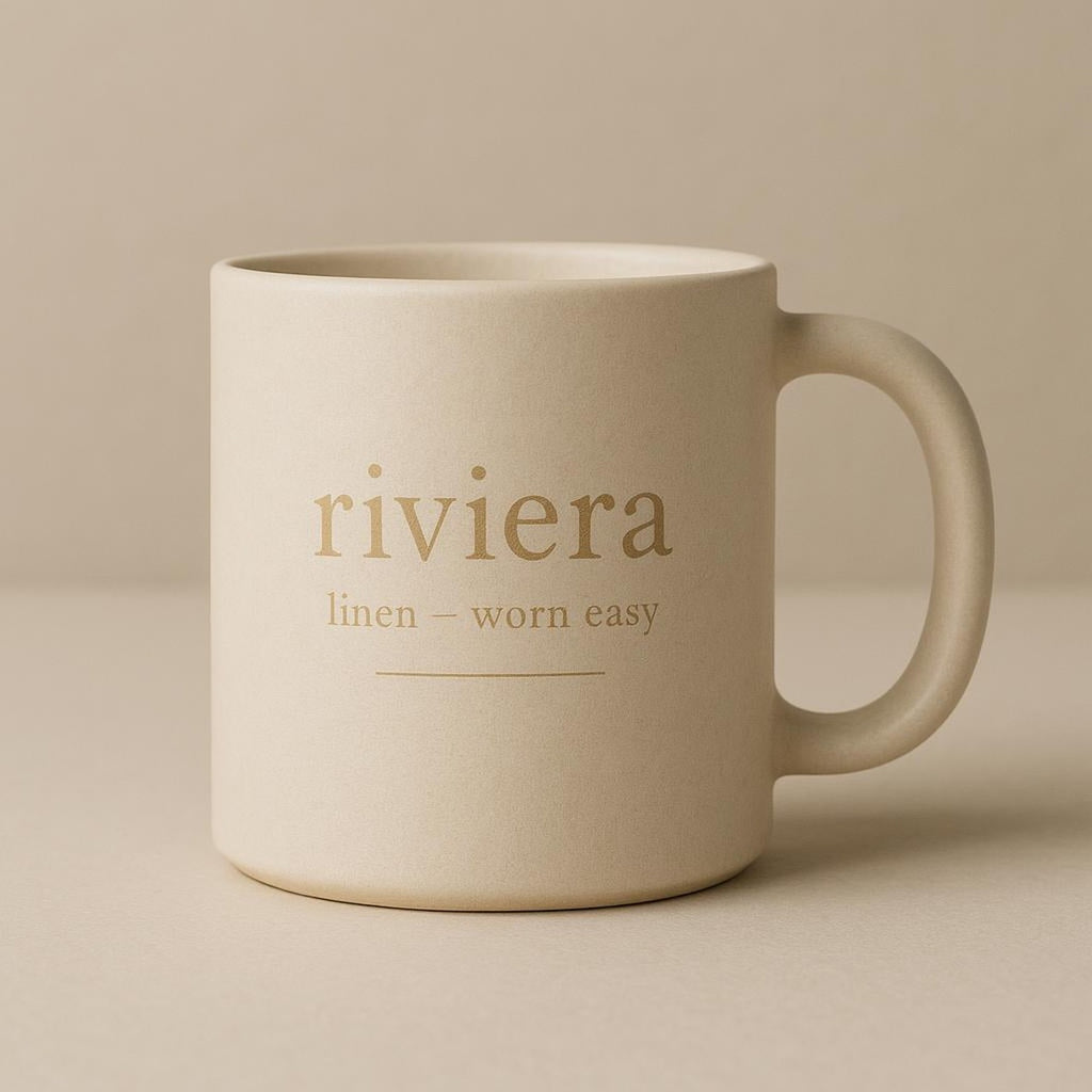 Two Riviera linen mugs paired with a linen table runner for relaxed morning styling