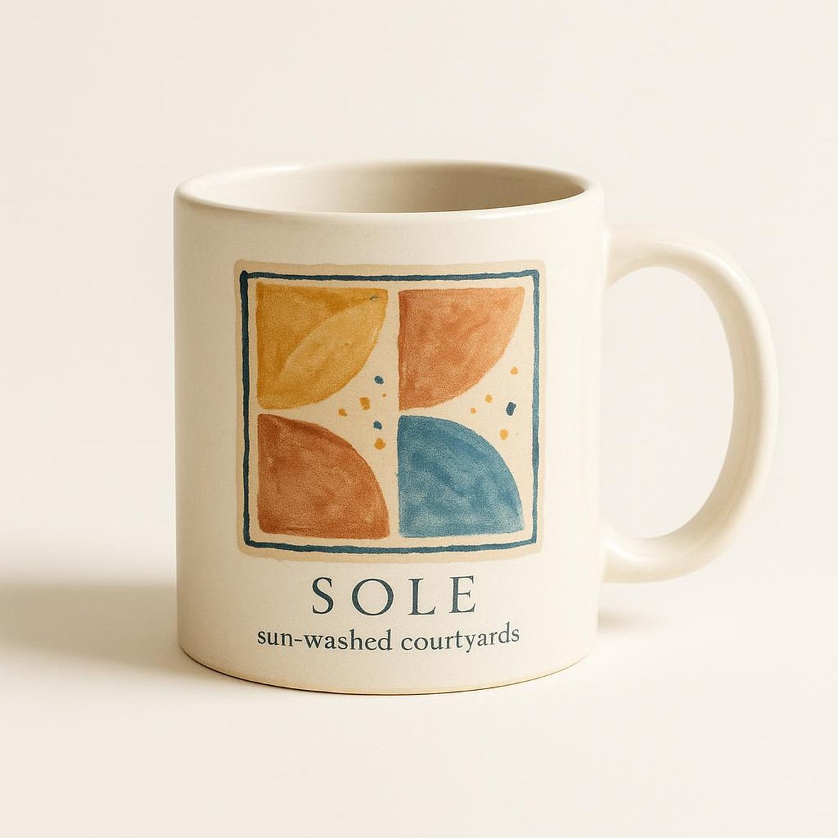 Hand-glazed ceramic mug with sun-washed ochre and azure terrazzo pattern on a neutral background