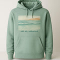Sea-glass green heavyweight loopback hoodie shown flat on a pale sandy background