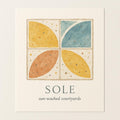 Hero view of Terrazzo Sole poster showing ochre and azure tile-inspired terrazzo pattern on matte paper