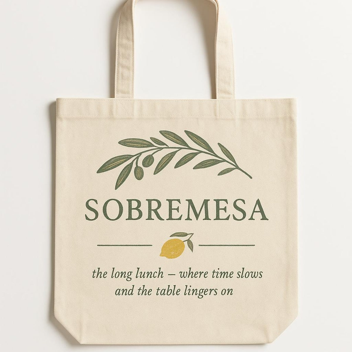 Natural cotton tote bag printed with a rustic ceramic carafe in coastal blue glaze, shown flat on a linen backdrop