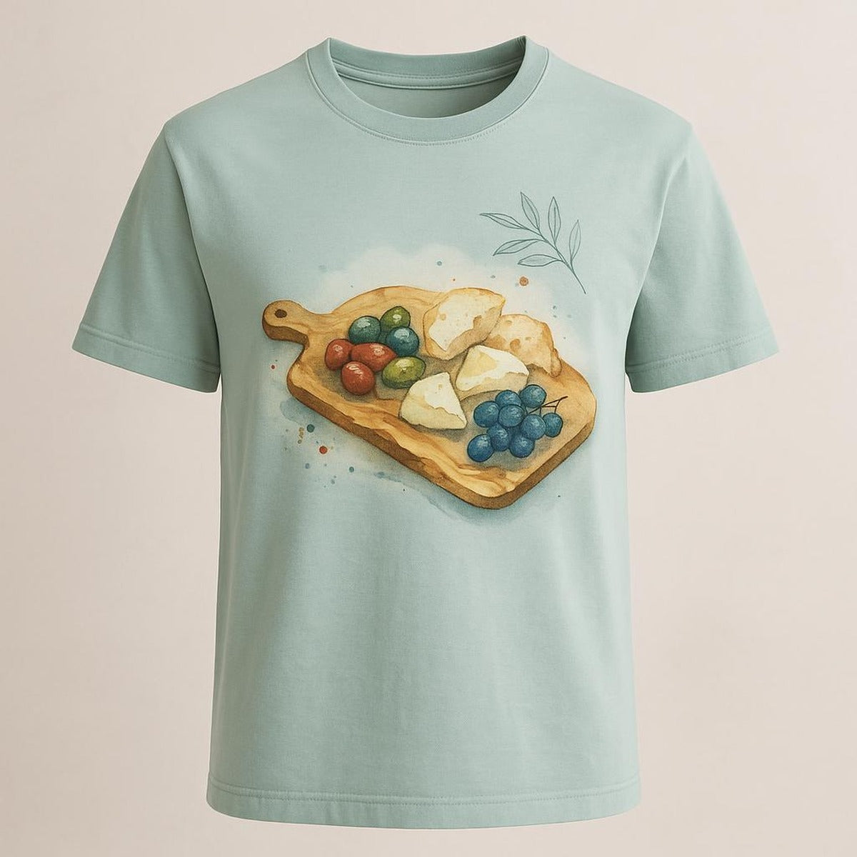 Model in the cream and olive tee relaxing in a warm, plant-filled kitchen setting