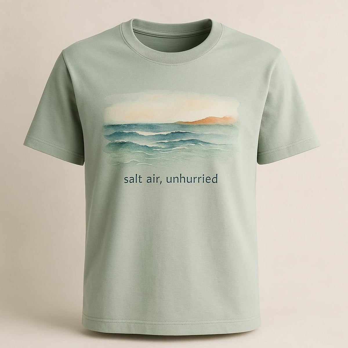 Flat-lay of the sea-glass tee with size chart and care details visible
