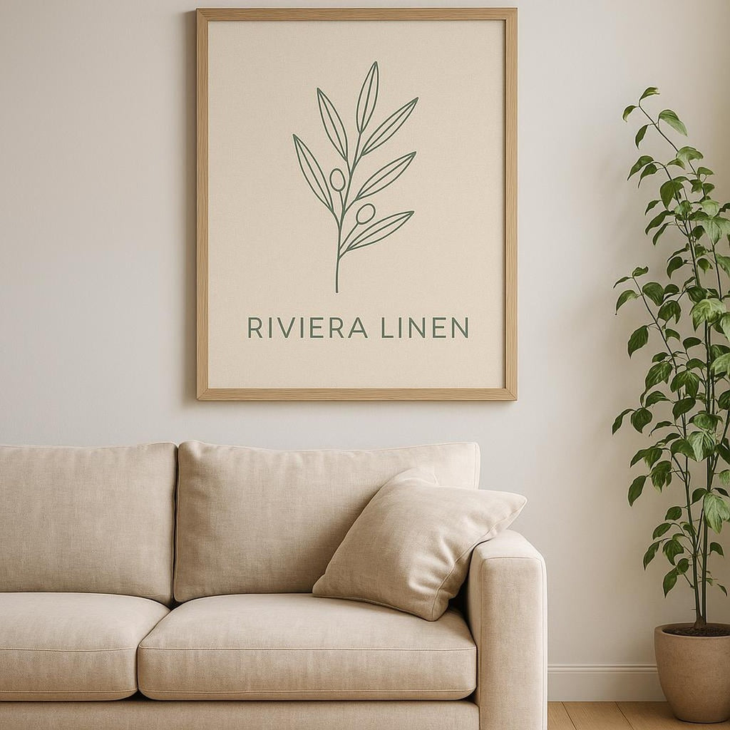 Neutral gallery wall featuring the linen shirt print alongside coastal photography and timber frames
