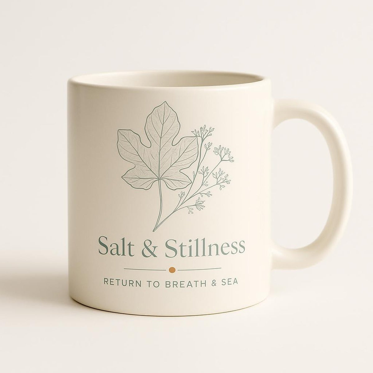 Sea salt white ceramic mug with soft botanical fig leaf design on a plain background