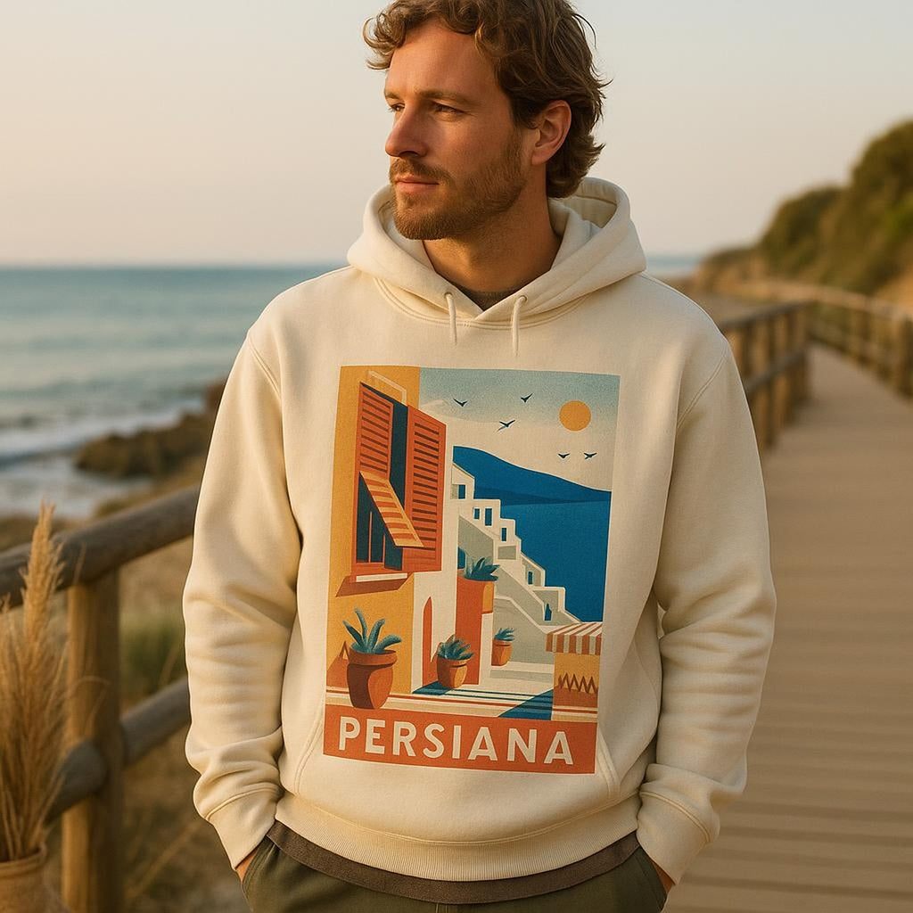 Person wearing the sun-stripe hoodie in soft afternoon light beside a plaster wall