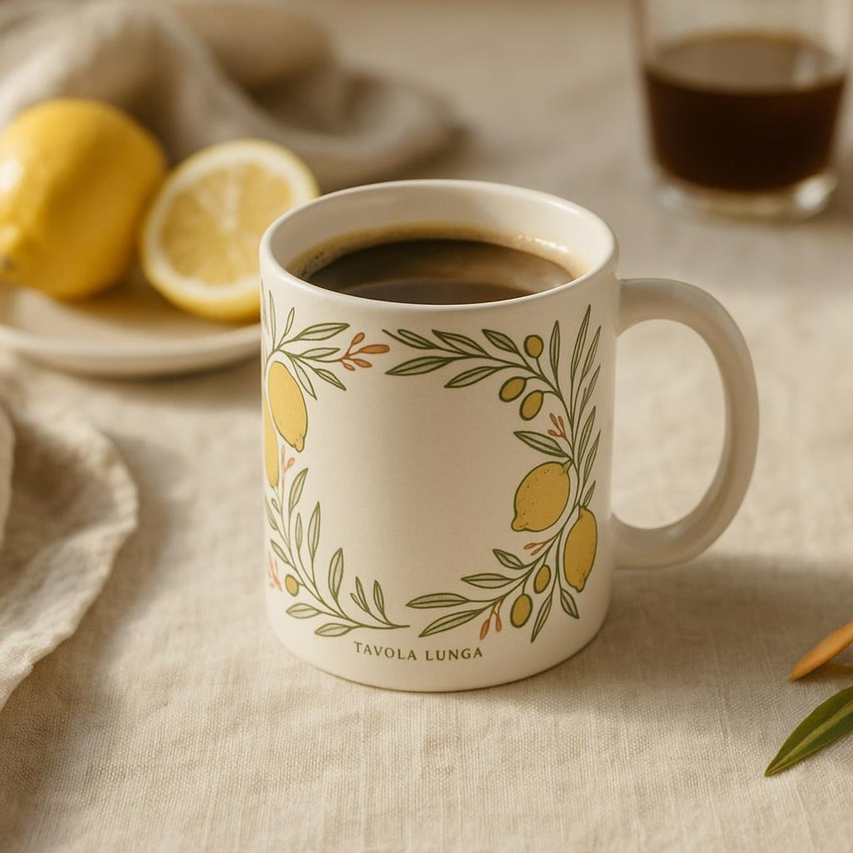 Lifestyle image of the lemon and olive mug filled with coffee on a sunlit breakfast table