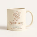 Cream ceramic mug with sage green Piccolo Lusso design on a neutral background
