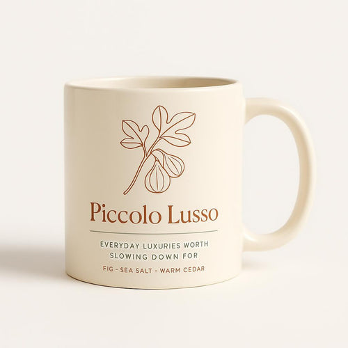Cream ceramic mug with sage green Piccolo Lusso design on a neutral background