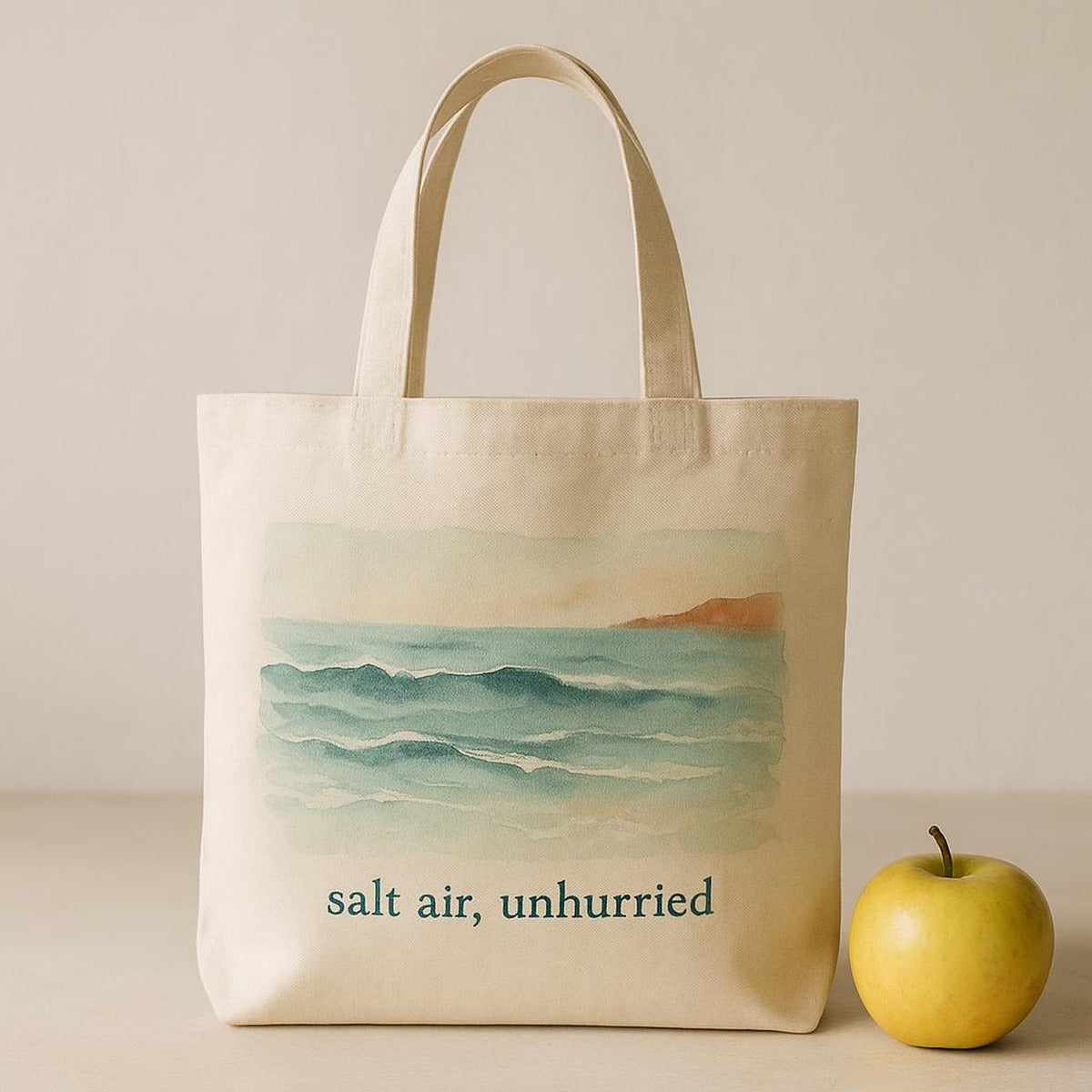Interior view of the unhurried tote holding a rolled beach towel, water bottle and book