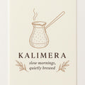 Hero poster of a hand-hammered copper cezve coffee pot with brass handle on a soft cream background