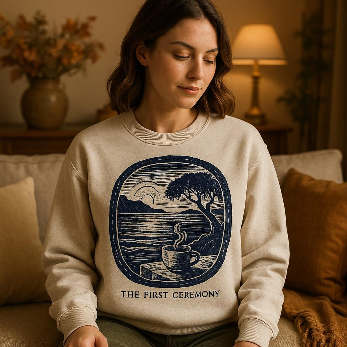 Model wearing the relaxed-fit sweatshirt beside a coffee bag and wooden scoop for scale