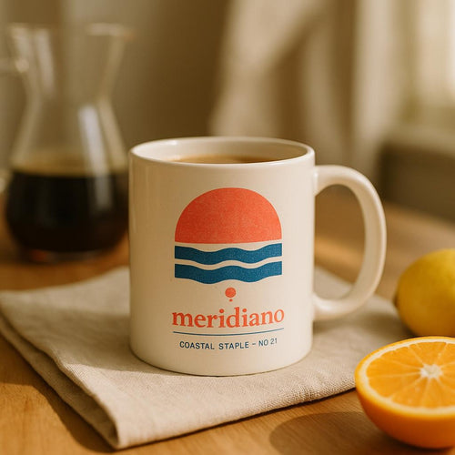 Lifestyle photo of the Meridiano mug filled with coffee on a sunlit breakfast table