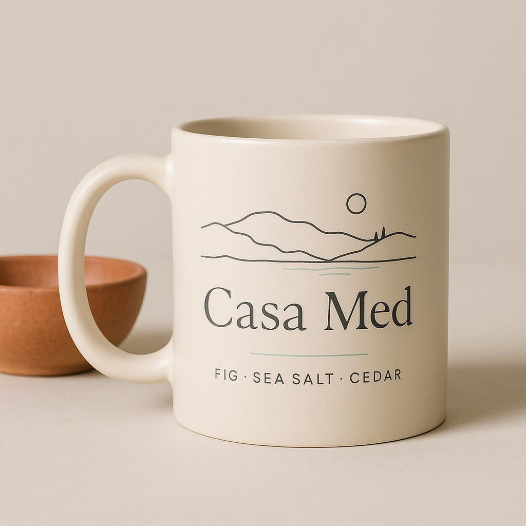 Cream and terracotta mug held in one hand to show its comfortable, substantial size