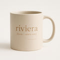 Off-white ceramic mug with sand-toned linen-inspired design on a neutral background